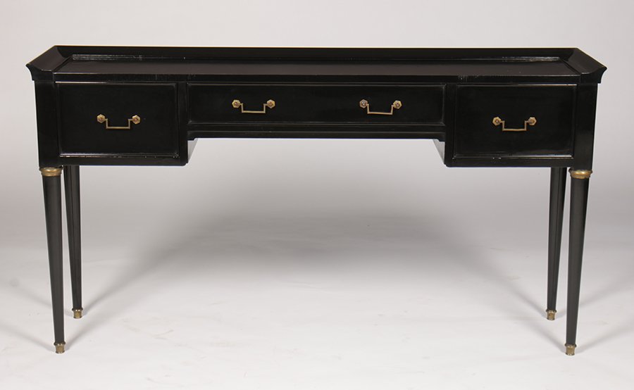 REGENCY 3 DRAWER EBONIZED CONSOLE SOFA TABLE: A Regency style three drawer ebonized console or sofa table having bronze trim and gold gilt glass top circa 1940. Ht: 30.75" Width: 56.25" Depth: 13.25"