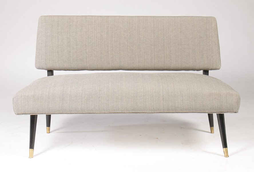 MID CENTURY MODERN SETTEE BRASS TRIMMED C.1960: A mid century modern upholstered settee having brass trimmed mahogany legs circa 1960. Ht: 29" Width: 44" Depth: 29"