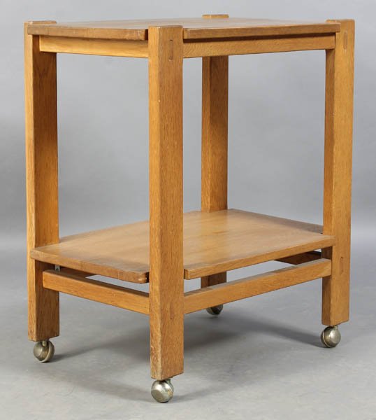 CHARLOTTE PERRIAND ATTR. SERVING CART C.1950: A Charlotte Perriand (attributed) oak two-tiered serving cart having mortis and tenon construction on casters circa 1950. Ht: 29.75" Width: 26" Depth: 17.5"