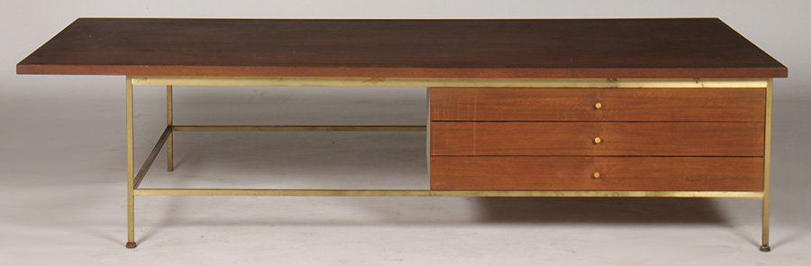PAUL MCCOBB CALVIN GROUP COFFEE TABLE BRASS BASE: A labeled Paul McCobb Calvin Group coffee table having three drawers supported on a brass base. Ht: 16.5" Width: 66" Depth: 32"
