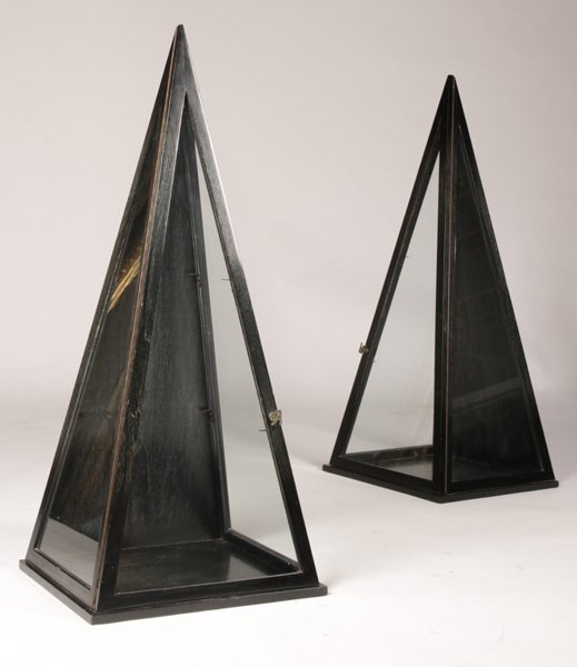 PAIR OF EBONIZED TRIANGULAR VITRINES C.1950: A pair of ebonized and cerused triangular vitrines by James Mont having glass front door and sides with Asian inspired door pulls circa 1950. Ht: 48" Width: 20.5" Depth: 18"