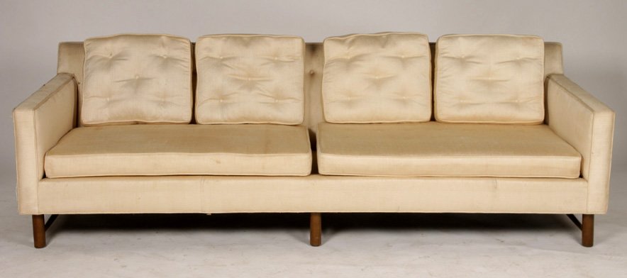 A LABELED EDWARD WORMLEY DUNBAR TAILORED SOFA: A labeled Edward Wormley for Dunbar tailored sofa having loose cushion back and seat raised on turned legs. Ht: 28" Width: 90" Depth: 31"