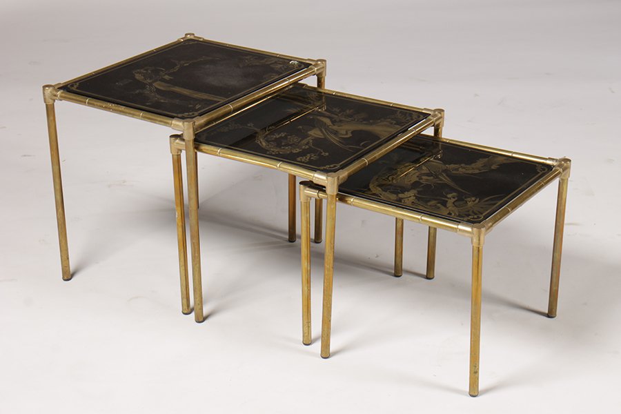 SET 3 BRASS NESTING TABLES GLASS TOPS BAMBOO LEGS C1970: A set of three brass nesting tables having gilt and black decorated glass tops with birds and floral decoration supported on faux bamboo legs. c1970 Ht: 20" Width: 18" Depth: 16"