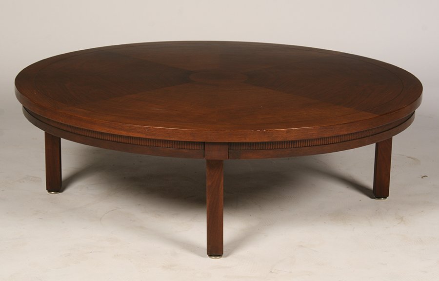 LABELED JEN RISOM COFFEE TABLE C. 1970: A labeled Jens Risom walnut round coffee table having incised banding line all raised on straight legs circa 1970. Ht: 15" Dia: 48"
