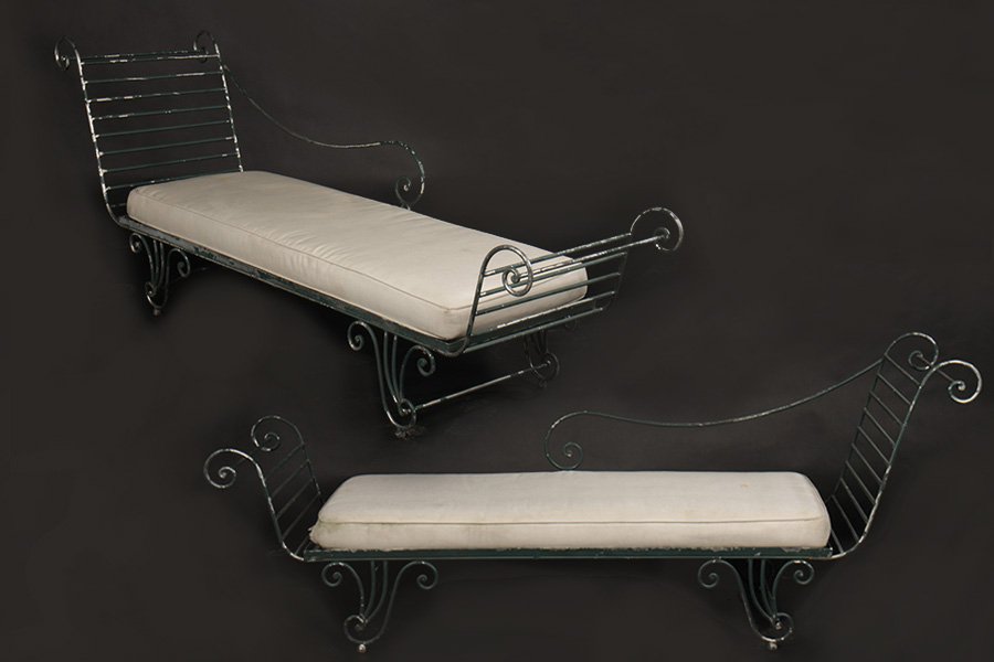 PAIR OF STYISH WROUGHT IRON CHAISE LOUNGES: A pair of stylish wrought iron chaise lounges each having scrolling backs and upholstered cushion. Ht: 36" Width: 92" Depth: 24"