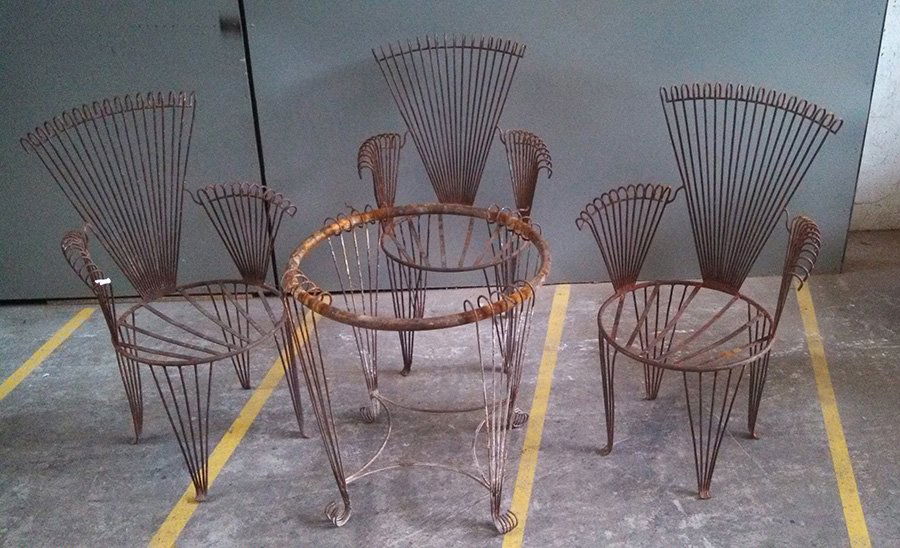 3 IRON ARM CHAIRS AND MATCHING TABLE C. 1930: A set of three iron arm chairs and a matching table circa 1930. Ht: 36" Width: 22.5" Depth: 17"