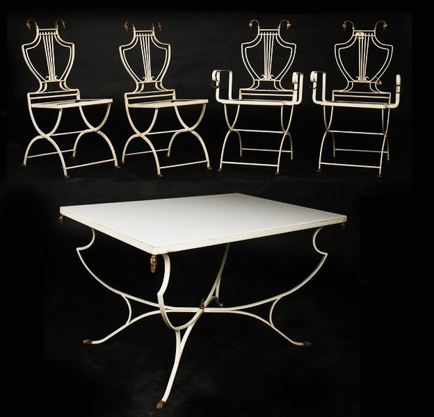 REGENCY STYLE IRON BRONZE TABLE CHAIRS C.1950: A Regency style iron and bronze table and chairs circa 1950. The table having swan heads and feet as do the two arm and two side chairs. Ht: 30" Width: 48" Depth: 32"