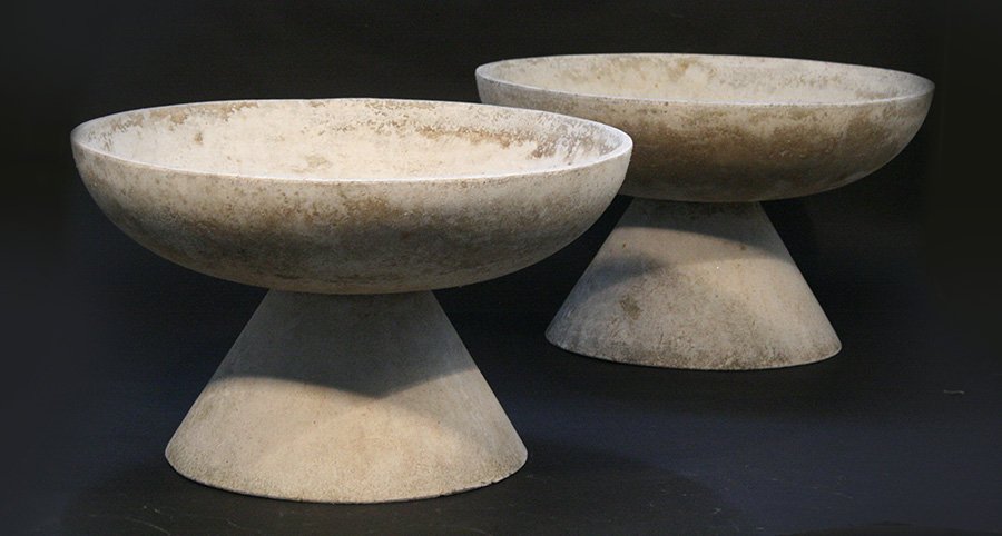 PAIR 20TH CENTURY WILLY GUHL CAST STONE PLANTERS: A pair of twentieth century Willy Guhl attributed cast stone garden planters having shallow bowls raised on conical bases. Ht: 14.5" Dia: 24"