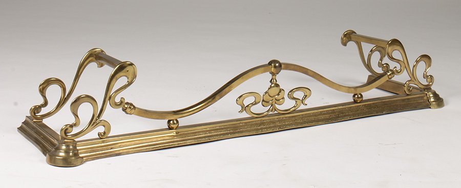 ART NOUVEAU STYLE BRASS FIREPLACE FENDER C. 1915: An Art Nouveau style brass fireplace fender circa 1915. Ht: 9.5" Width: 52" Depth: 13"