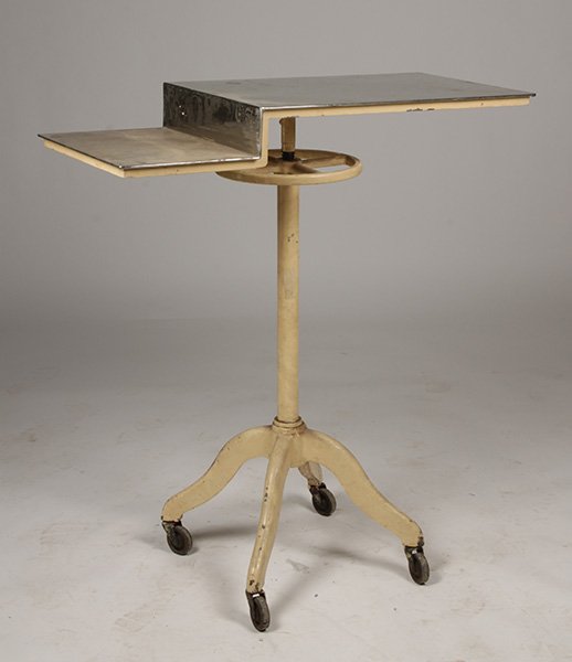 VINTAGE INDUSTRIAL METAL TABLE C. 1930: A vintage industrial metal table having stepped chrome top supported on adjustable metal base with casters circa 1930. Ht: 44" Width: 39.5" Depth: 18"