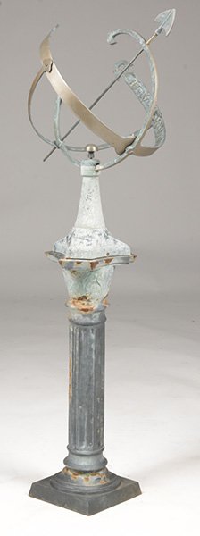 BRONZE ARMILLARY FLUTED IRON COLUMN FORM BASE: A bronze armillary resting on a fluted iron column form base circa 1950. Ht: 52" Width: 16" Depth: 16"