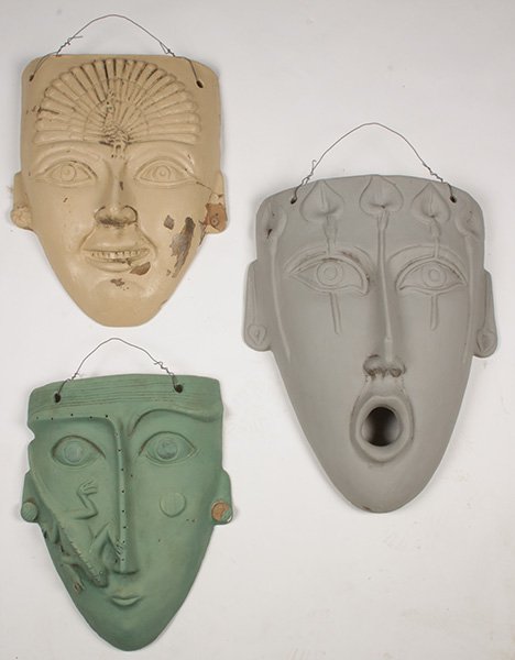 3 EARTHENWARE FIGURAL GARDEN MASKS PAINTED: A lot of three earthenware figural garden masks, all painted in different colors. Ht: 27" Width: 19"