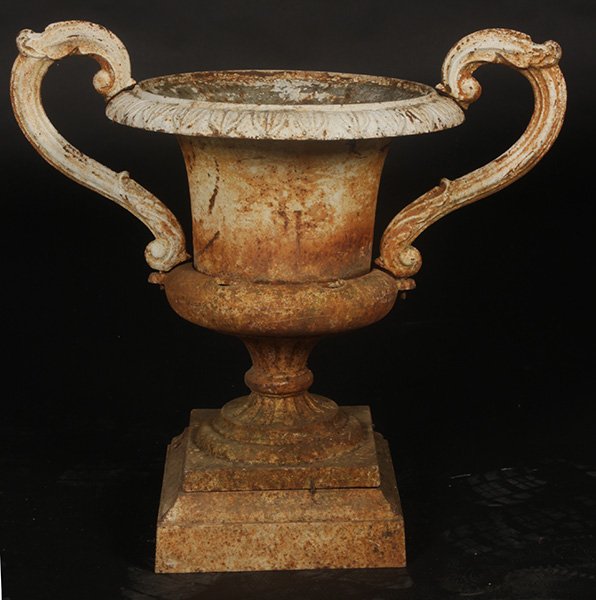 AMERICAN VICTORIAN CAST IRON URN BRIDGE BUFFALO: American Victorian cast iron garden urn labeled Bridge Buffalo circa 1900. Having egg and dart decoration and two scrolling handles raised on a stepped base. Ht: 23" Width: 15.5"