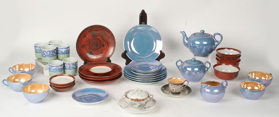 41 PC COLLECTION ASIAN PORCELAIN TABLE TEA WARES: Forty-one piece collection of Asian porcelain table and tea wares. Consisting of an eighteen piece Japanese tea set, a twelve piece red and silver hoho bird soup service, six tea cups, a dragonware de
