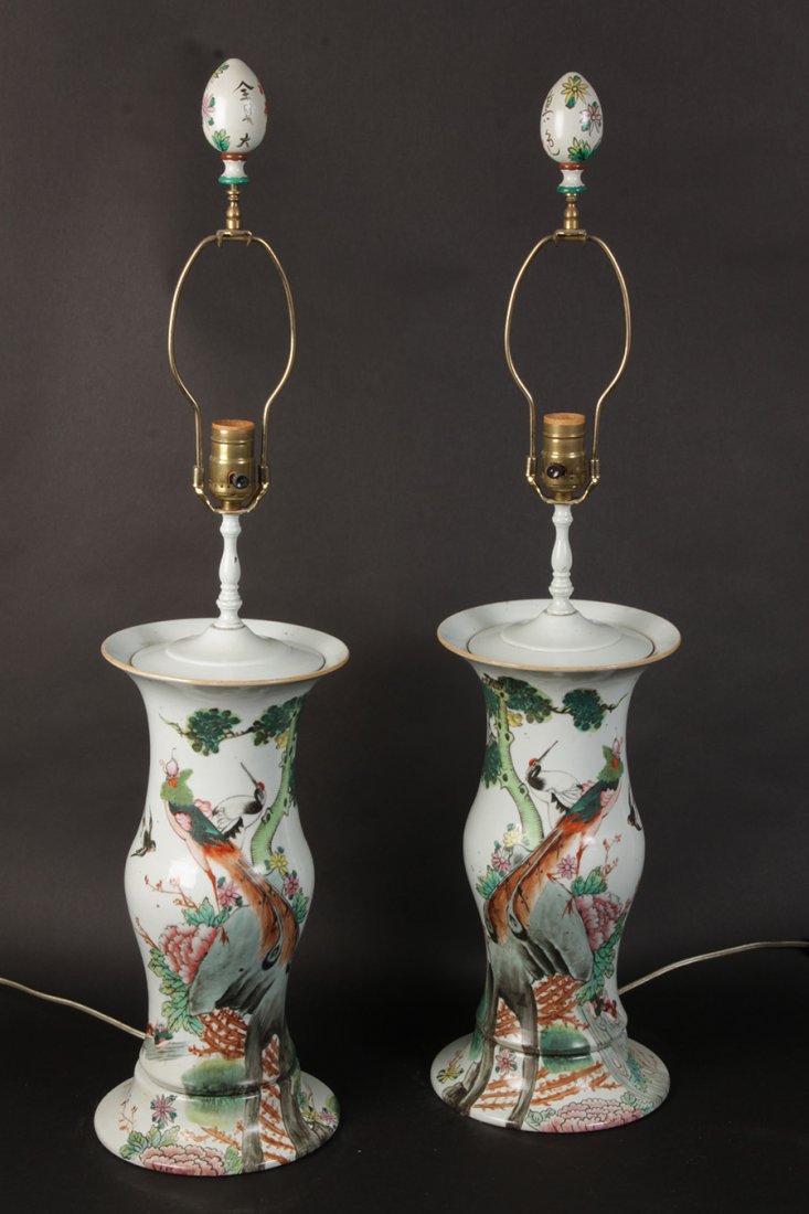 PAIR HAND PAINTED PORCELAIN CHINESE TABLE LAMPS: A pair of hand painted porcelain Chinese vase form table lamps. Ht: 32" Width: 7.5"