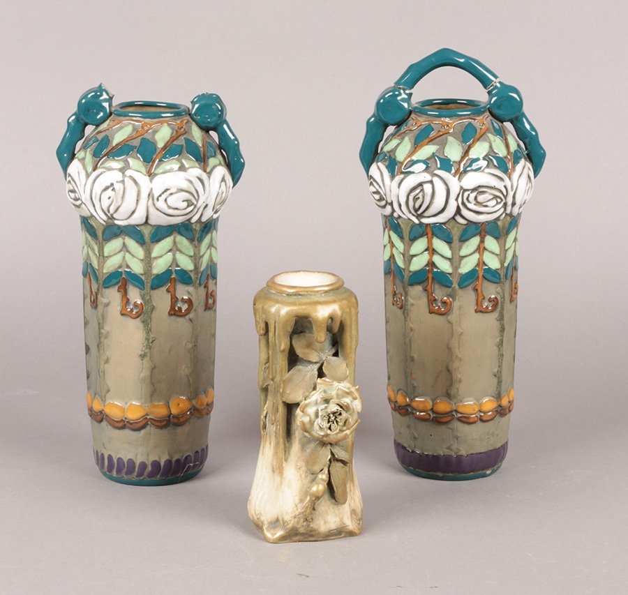 3 AMPHORA POTTERY WITH FLORAL MOTIF C. 1930: Three amphora pottery pieces which includes a pair with stylized white rose and a smaller foliate example with drip formed handles circa 1930. Ht: 12" Width: 5" Depth: 4"