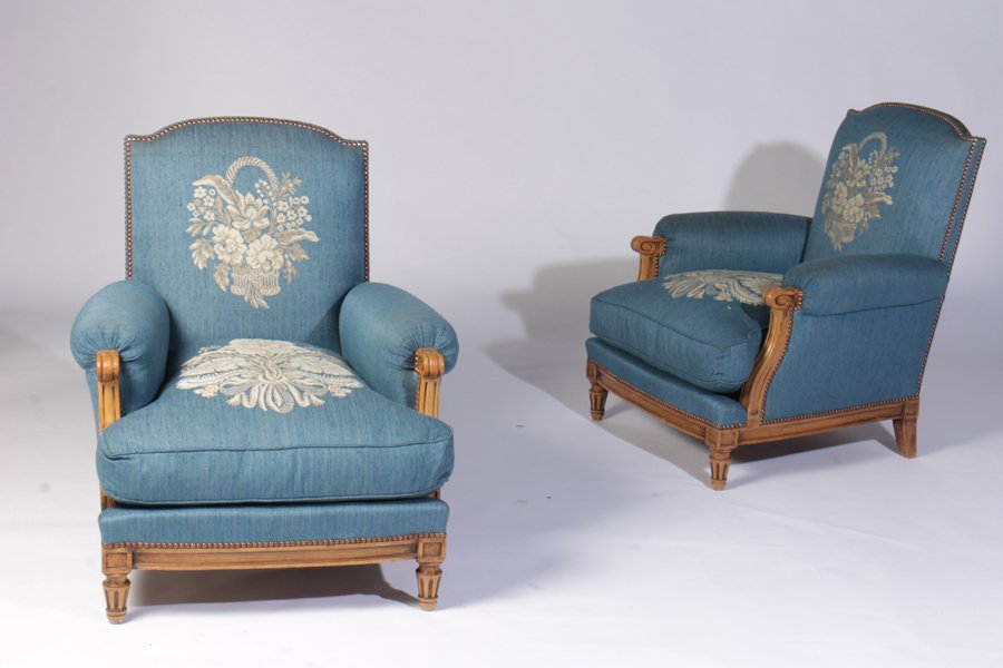 PAIR FRENCH LOUIS XVI STYLE BERGERES C.1960: Pair of French Louis XVI style bergeres having Jules Leleu inspired woven upholstered back and seats with turned and fluted legs circa 1960. Ht: 36" Width: 31" Depth: 27"