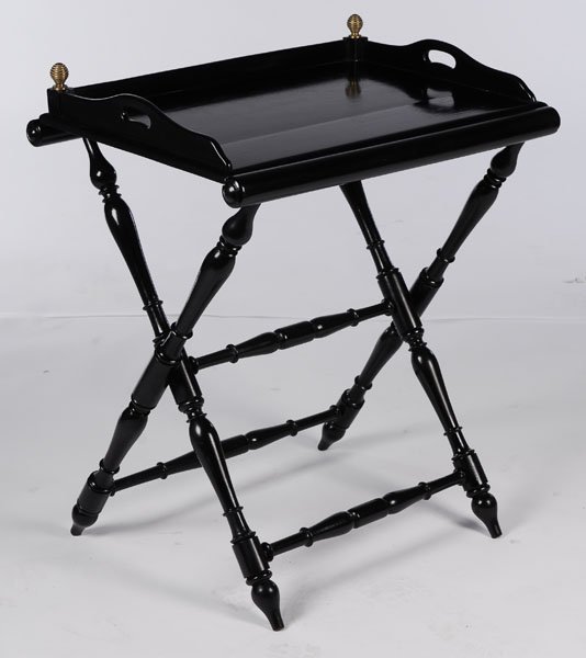 EBONIZED BUTLERS TRAY FOLDING X-FORM BASE: A stylish ebonized butlers tray having galleried tray supported on folding x-form base with turned legs. Ht: 31" Width: 27.5" Depth: 20"