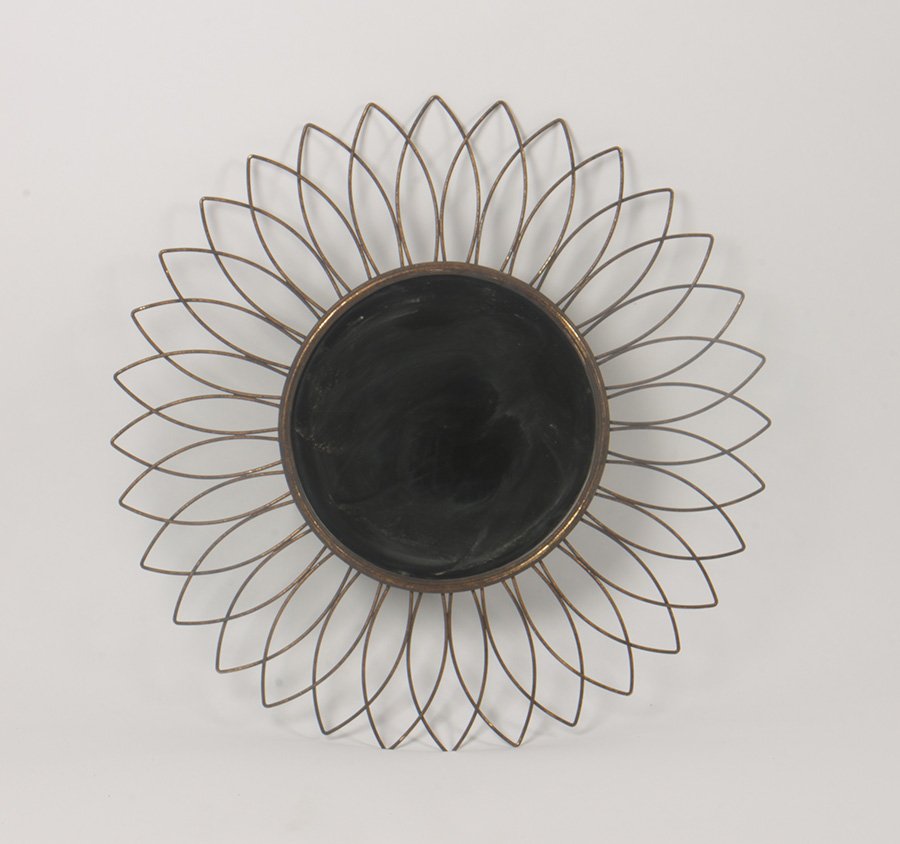 GILT IRON SUNBURST FORM BEVELED MIRROR: A gilt iron sunburst form beveled mirror. Dia: 28"