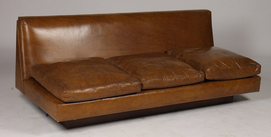 MID CENTURY LEATHER COUCH CUSHION SEATS C.1970: A mid century modern leather couch having three loose cushion seats and platform base circa 1970. Ensuite with the following lot. Ht: 27" Width: 71" Depth: 32"