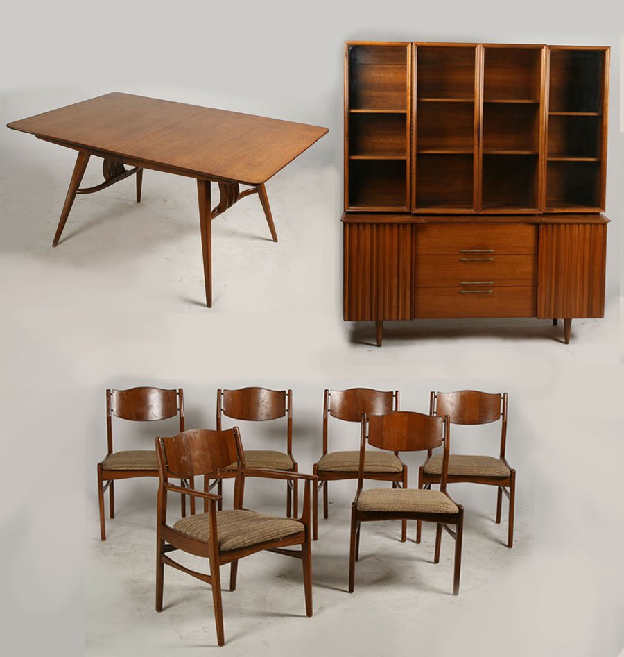 MID CENTURY MODERN DINING SET BREAKFRTON TABLE: A mid century modern dining set consisting of a table with two leaves, breakfront and six chairs circa 1970. Width: 12" (each leaf) Ht: 32" Width: 21.5" (each chair) Ht: 30" Width: 60" Depth: 40" (tab