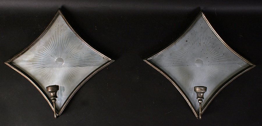 PR SCONCES DISTRESSED MIRROR ETCHED SUNBURST: A pair of sconces having stylized diamond form distressed mirrored backs with etched sunburst decoration supporting a single candle. Ht: 16" Width: 16"