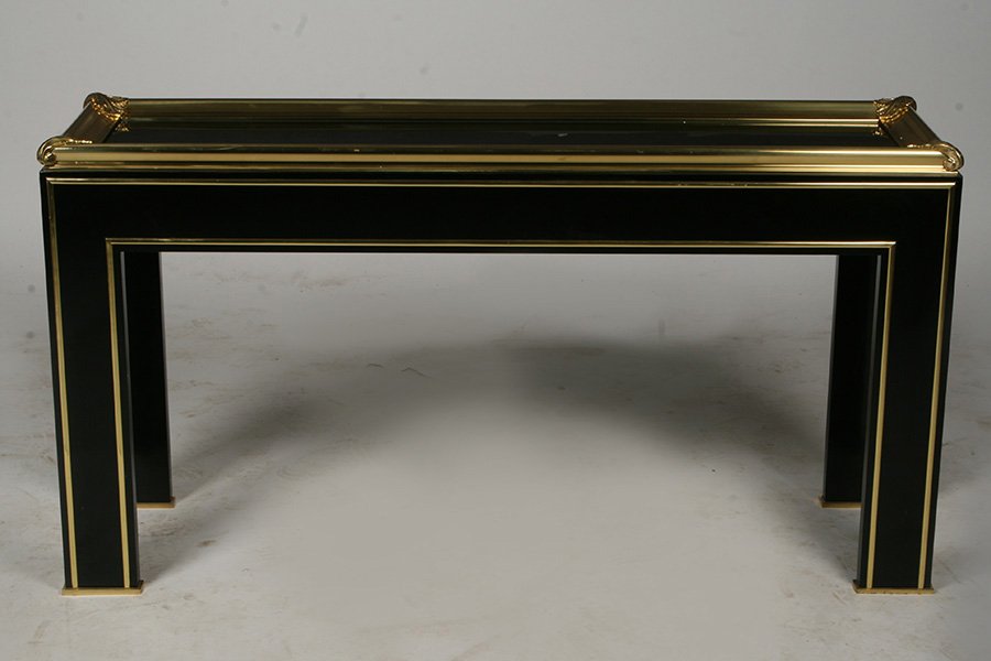 JANSEN EBONIZED WOOD BRONZE MIRRORED TABLE 1970: A Jansen ebonized wood and bronze mirrored top console table circa 1970. Ensuite with the following lot. Ht: 30" Width: 57" Depth: 16"