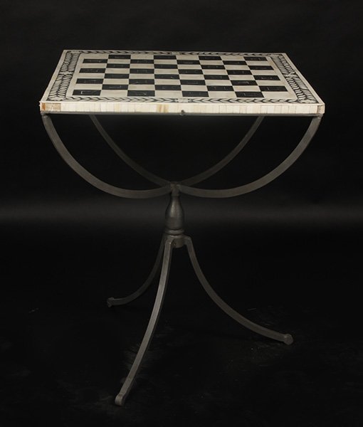 HORN INLAID GAMES TABLE WROUGHT IRON BASE: A horn inlaid games table supported on wrought iron base. Ht: 28" Width: 24" Depth: 24"