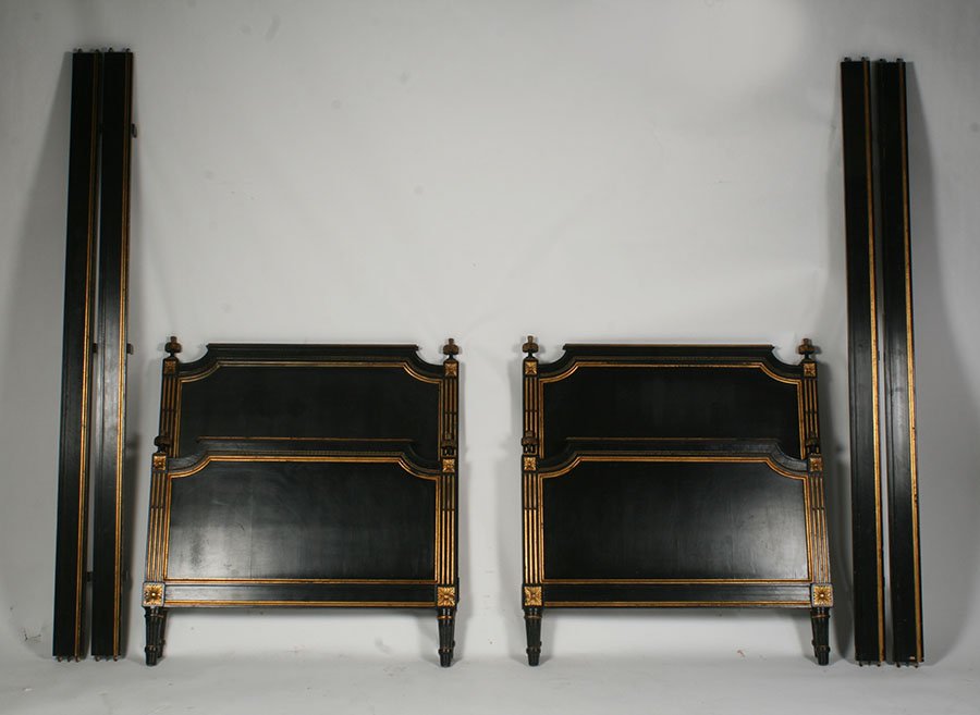 PAIR OF DIRECTOIRE EBONIZED GILT BEDS C.1940: A pair of Directoire style ebonized and gilt decorated single beds circa 1940. Ht: 42" Width: 38.5"