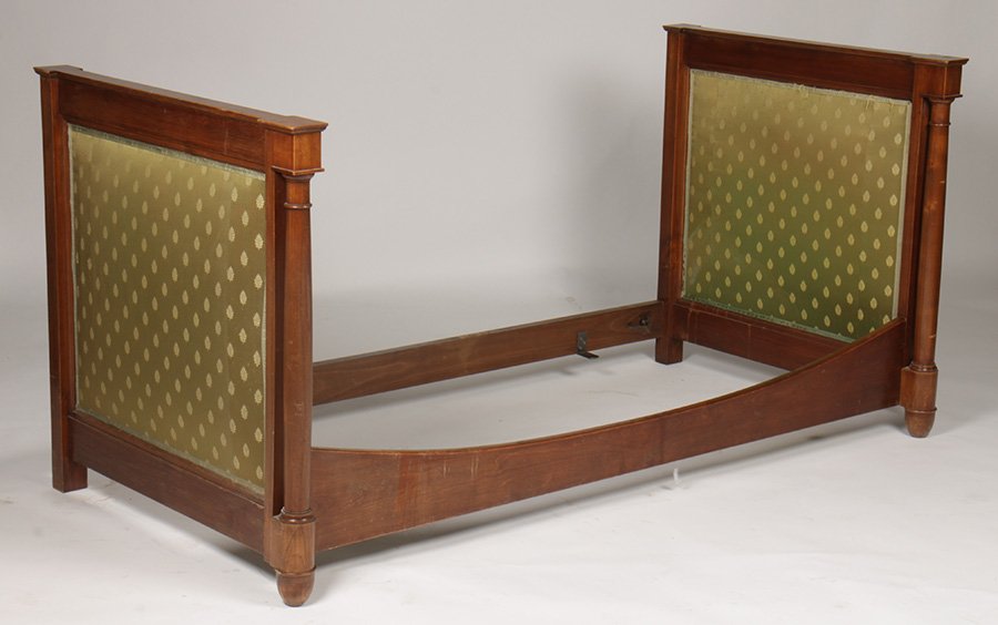 FRENCH EMPIRE WALNUT UPHOLSTERED DAYBED 1900: A French Empire style walnut and upholstered daybed circa 1900. Dimensions: Ht: 38" Width: 78" Depth: 38"