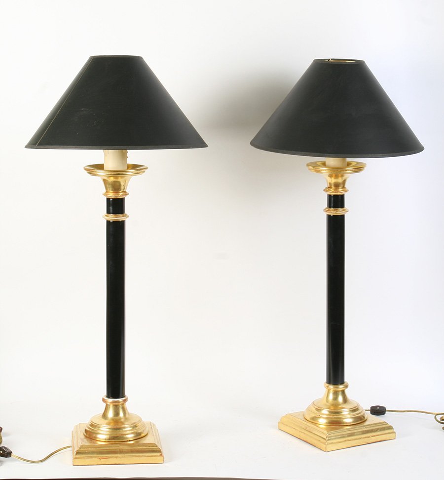 PAIR OF EBONIZED GILT WOOD TABLE LAMPS COLUMN: A pair of ebonized and gilt wood table lamps having a column form. Ht: 31" Width: 15" (including shade)