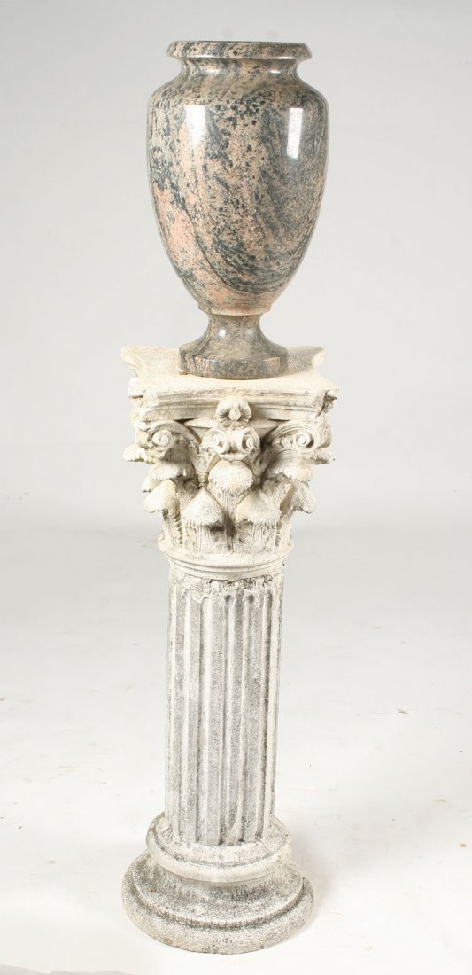 GRANITE URN ON CONCRETE PEDESTAL CORINTHIAN: A turned granite urn atop a concrete pedestal with a Corinthian capital. Ht: 63"