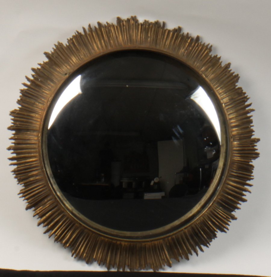 BRONZE CONVEX MIRROR SUNBURST FRAME 1950: A stylish bronze convex mirror having a banded interior border and sunburst frame circa 1950. Dia: 19"