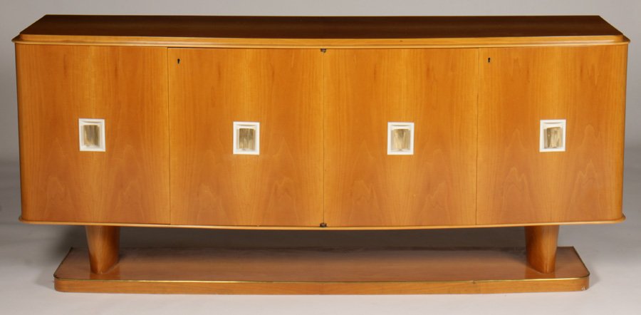 FRENCH MID CENTURY MODERN SIDEBOARD CIRCA 1940: Good French mid century modern sideboard with stepped top over curved front with four doors having inset brass hardware circa 1940. Raised on a platform base. Ht: 36.5" Width: 82" Depth: 20"