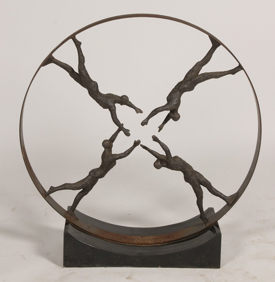 ERNEST TROVA ATTR. CAST IRON FIGURAL SCULPTURE: An Ernest Trova attributed cast iron figural sculpture having a border ring with four figural mounts, all raised on marble base. Ht: 41.75" Width: 39.5"
