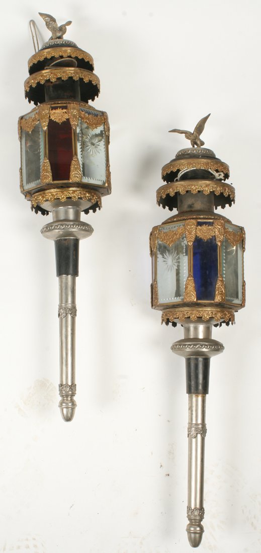 PR LATE 19TH C. GILT TOLE GLASS CARRIAGE LANTERNS: Pair of late nineteenth century gilt and silvered brass, tole, and cut glass carriage lanterns. Each lantern surrounded by a heroic eagle above concentric bands, and having cut glass and colored glass