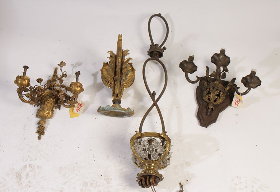 4 ANTIQUE LIGHTING ITEMS CHANDELIER SCONCES 1910: A collection of four antique lighting items circa 1910. Consisting of a single arm bronze sconce, a two arm bronze sconce, a three arm bronze and metal sconce, and a chandelier frame. Ht: 10" Width: 5
