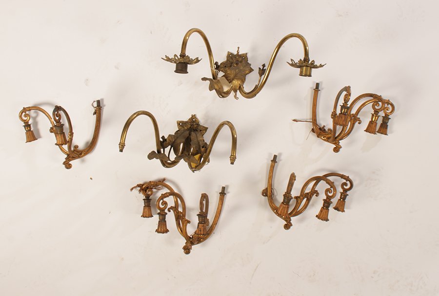 6 ANTIQUE BRONZE LIGHTING ITEMS SCONCES ARMS 1900: A collection of six antique bronze lighting elements consisting of a pair of two arm foliate sconces and four chandelier arms circa 1900. Ht: 8" Width: 17" Depth: 16" (sconces)