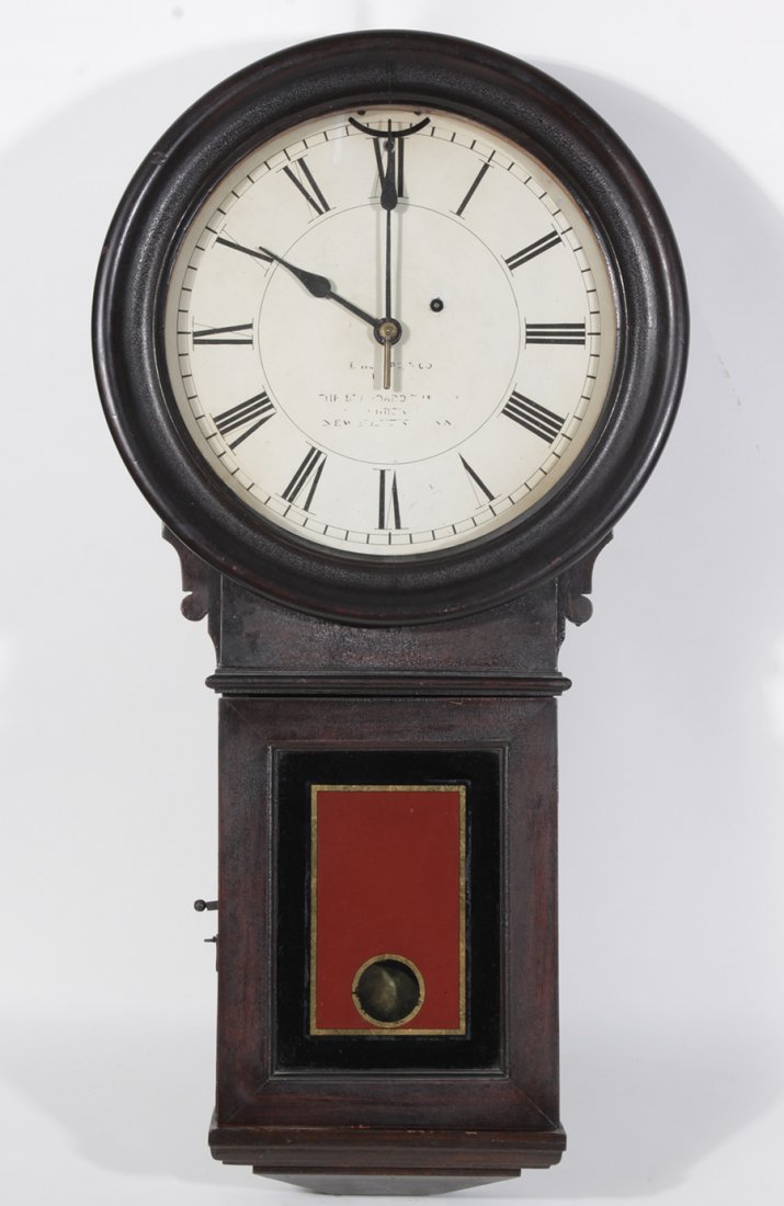 RARE E. HOWARD #70 WALNUT LABELED 1923: A rare "E.Howard Number 70" in walnut retaining original throat glass and dial circa 1923. The dial reads "E. Howard & Co., Boston. The Standard Time Co. Synchronizer, New Haven, Conn." Ht: 31" Width:
