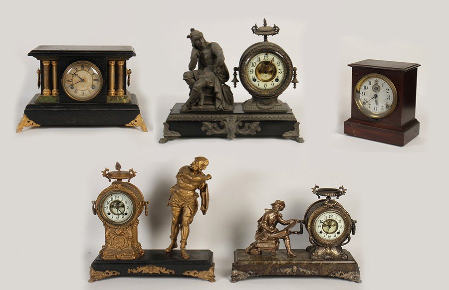 5 CLOCKS 2 NEW HAVEN SETH THOMAS WATERBURY 1900: A lot of five clocks to include two New Haven statuary clocks, a Seth Thomas alarm clock, and a Waterbury black mantle clock circa 1900. Along with an Ansonia statuary clock. Ht: 20" Width: 19" Depth: