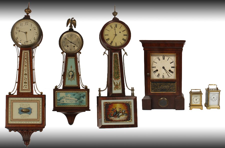 6 CLOCKS S. WILLARD PATENT BANJO SETH THOMAS: A group of six clocks to include 'S. Willard Patent' Banjo, a Seth Thomas Banjo, a chariott themed Banjo, and a Seth Thomas mantle clock. Along with two Waterbury carriage clocks. Ht: 40" Width: 10" D
