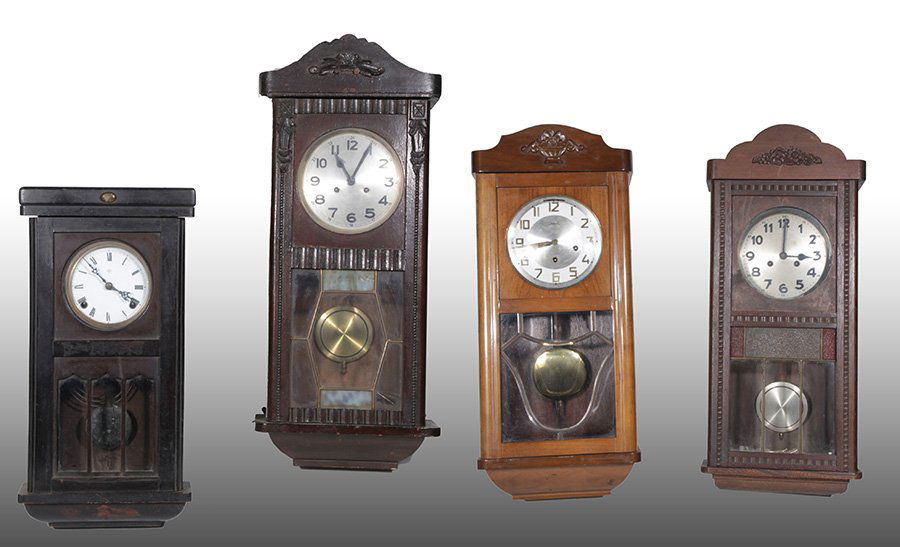 LOT OF WALL CLOCKS FANCK GERMANY FUHNGANS 1920: A lot of four wall clocks to include a mahogany "Fanck" wall clock made in Germany, and a "Fuhngans" wall clock circa 1920. Along with two other wall clocks, all having segmented glass bottoms. Ht: 32