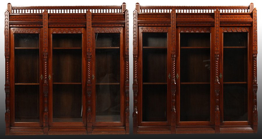 PR DANIEL PABST VICTORIAN WALNUT BOOKCASES C.1870: A pair of Victorian walnut modern gothic bookcases attributed to Daniel Pabst circa 1870. Having stepped gallery with carved and turned spindles above architecturally inspired lower cornice and three 