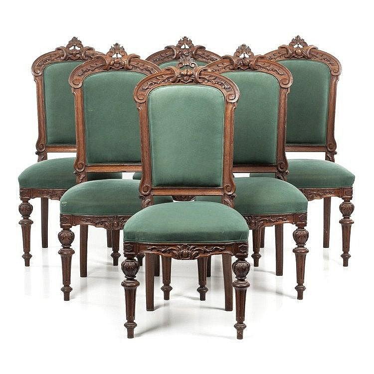 SET OF 15 CARVED OAK DINING ROOM CHAIRS C. 1890: A set of fifteen carved oak dining room chairs circa 1890. Ht: 41.75" Width: 19.75" Depth: 18"