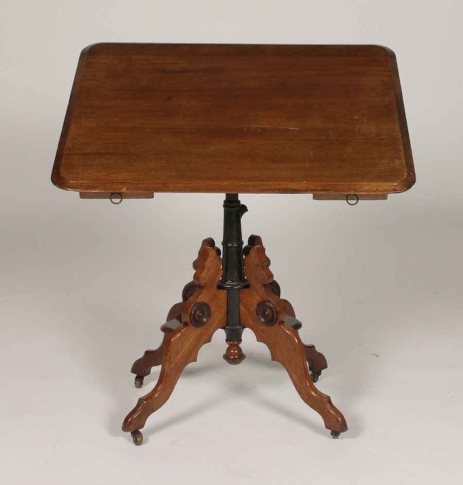 AM. VICT. LABELED GW GATES MECHANICAL TABLE 1880: American Victorian labeled 'G.W. Gates, Philadelphia' carved mahogany mechanical table circa 1880. Having a rotating, adjustable and sliding top supported on cast iron central post with shaped mahogan