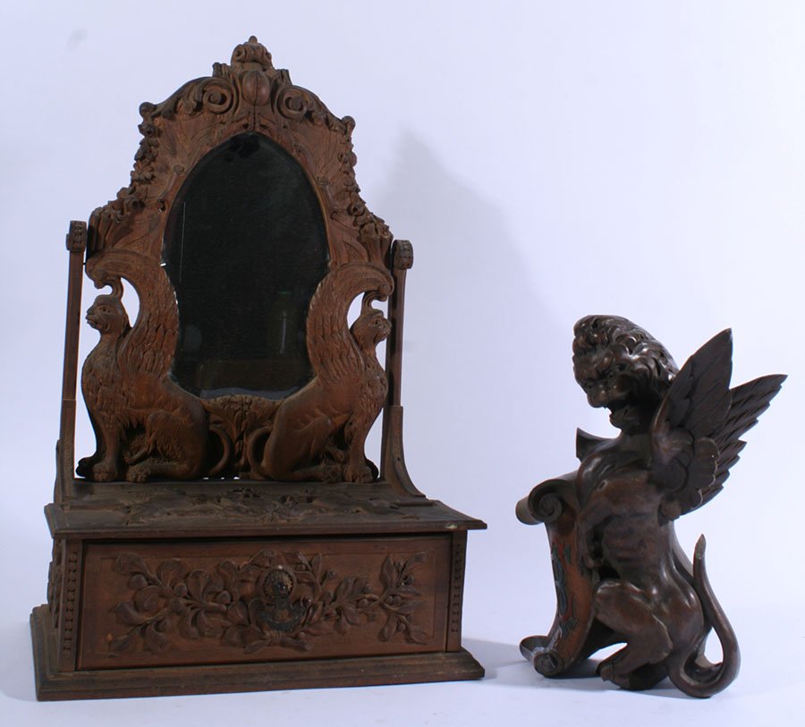 WALNUT GRIFFIN & MAHOGANY JEWELERY BOX C.1890: Two piece lot featuring a carved walnut griffin along with a carved mahogany jewelry box with a shaped beveled mirror, both circa 1890. Griffin has a "CRE" insignia. Dimensions: Ht: 22" Width: 14" Dep