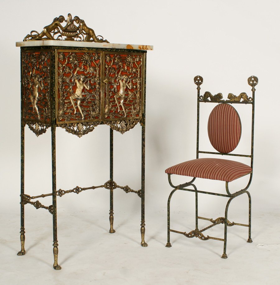 OSCAR BACH IRON BRONZE DEMILUNE CABINET 1920: An Oscar Bach iron and bronze demilune cabinet with stylized decoration along with matching chair having oval upholstered back circa 1920. Chair measures: Ht: 35" Width: 13.5" Depth: 12". Ht: 47.5" Wi