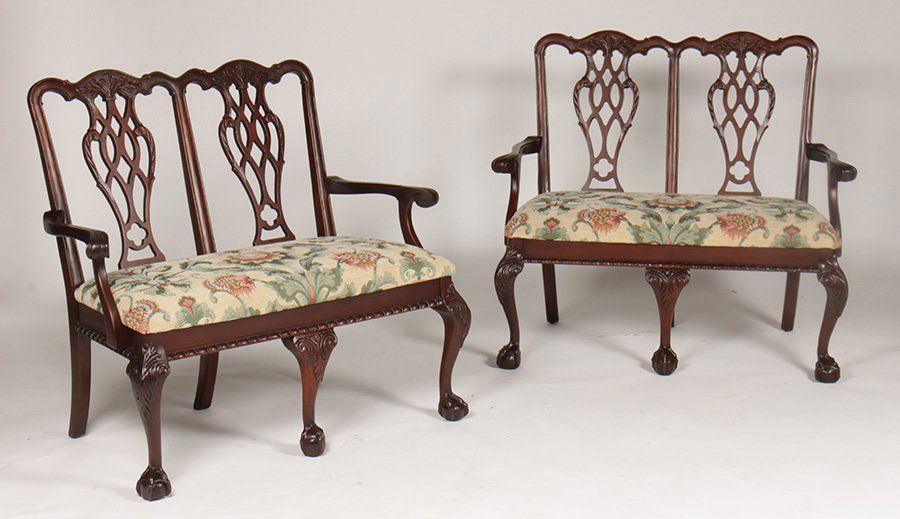PAIR KINDEL CARVED MAHOGANY CHIPPENDALE SETTEES: A pair of Kindel carved mahogany Chippendale style double chair back settees having shaped crest rail and pierced backsplat over upholstered seat. Supported on cabriole legs with ball and claw feet. H