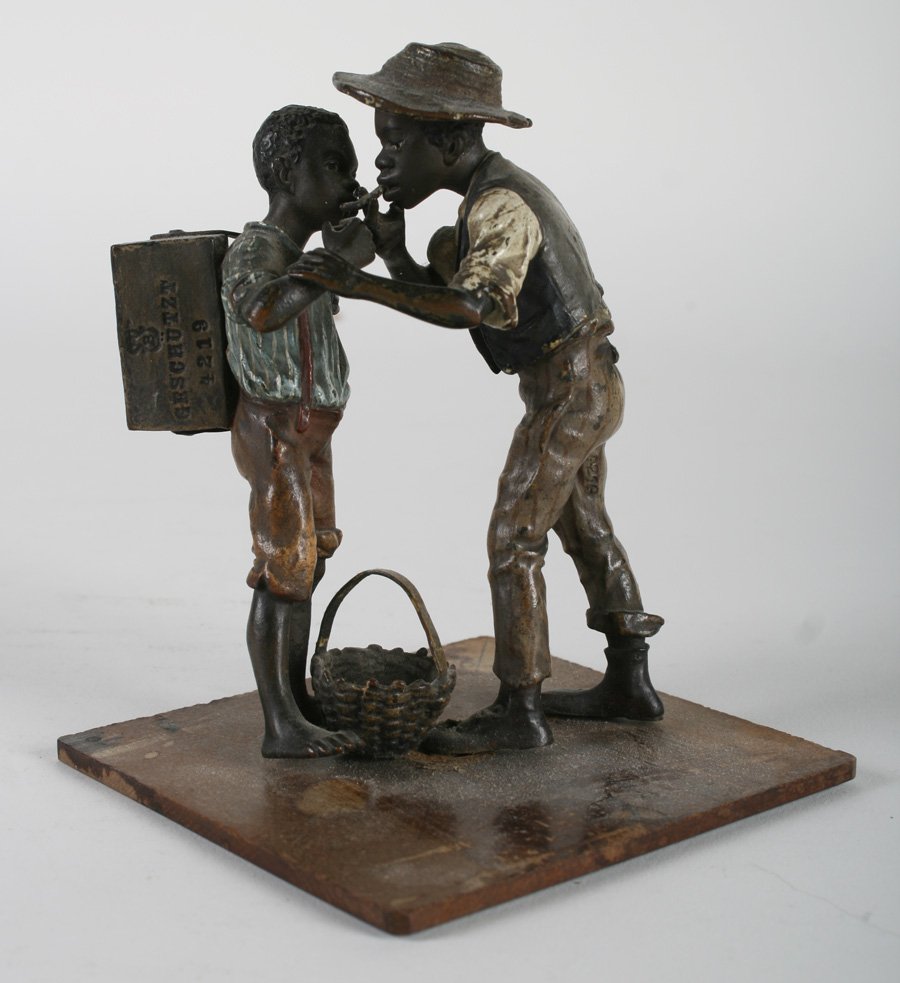 19TH C. BERGMAN AUSTRIA BRONZE FIGURAL GROUP BOYS: A rare late nineteenth century Bergman Austrian bronze figural group of two black boys sharing a cigarette. Marked with Bergman Amphora mark, Geschutzt and #4219. Ht: 4.5"