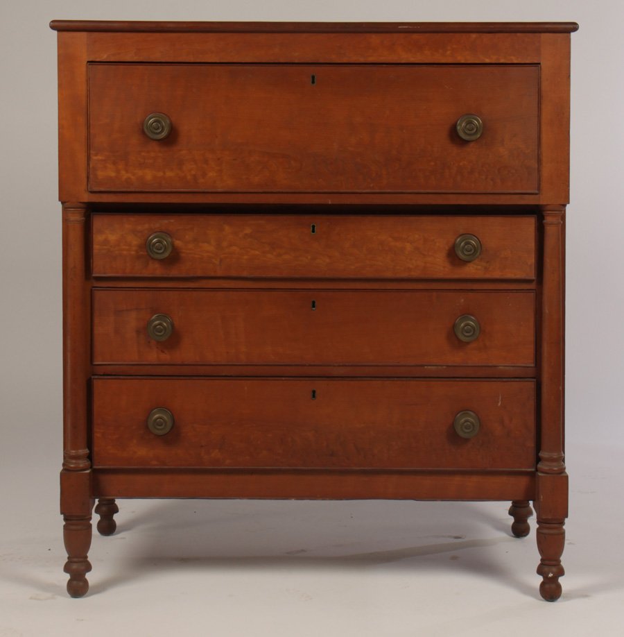 AMERICAN SHERATON CHEST OF DRAWERS CIRCA 1840: American Sheraton chest of drawers having four drawers flanked by half columns and raised on turned legs circa 1840. Ht: 47" Width: 42" Depth: 22"